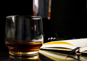reading and drinking whiskey